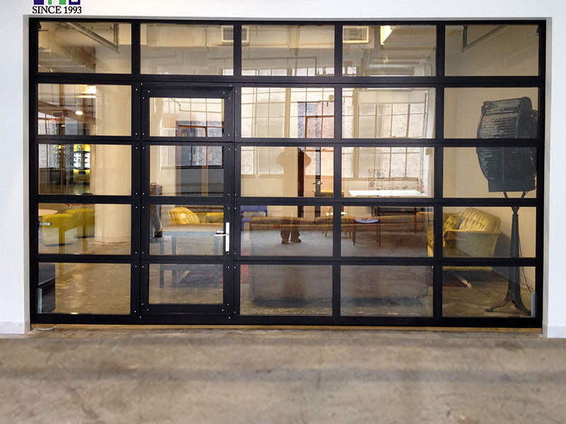 Glass garage door with pedestrian door